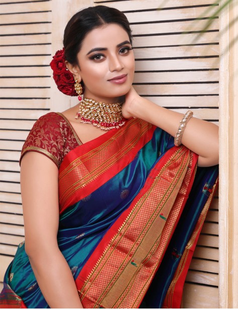 Blue coloured with red skirt border Paithani Saree